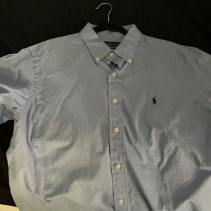 Long sleeve button down polo shirt . Blue with black polo logo